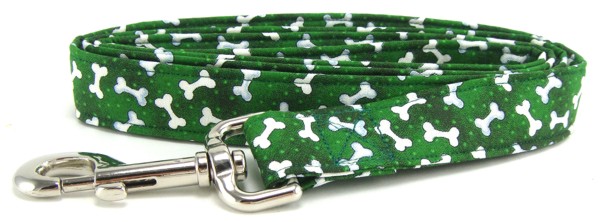 White tossed bones on green dog leash